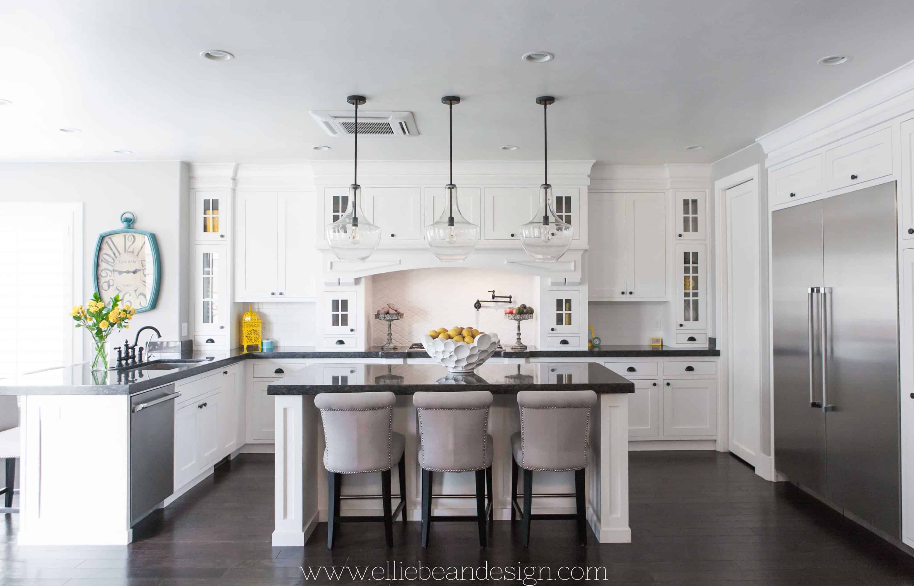 white kitchen design with large island