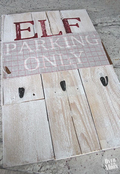 Rustic Elf Parking Pallet Sign Tutorial - your kids will love this! From www.overthebigmoon.com!
