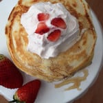 Strawberry Pancakes with Strawberry Vanilla Whipping Cream - this fruit breakfast is subtle, but super tasty! The whipping cream help makes this breakfast perfect! From www.overthebigmoon.com!