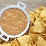 This Warm Chili Cheese Queso is a favorite of ours! Perfect for parties, potlucks and BBQ's! From overthebigmoon.com!
