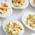 These Southern Deviled Eggs are perfect for holiday dinners and parties - Easter dinner, 4th of July BBQ's Thanksgiving Dinner or Christmas Dinner! A must-try! From overthebigmoon.com