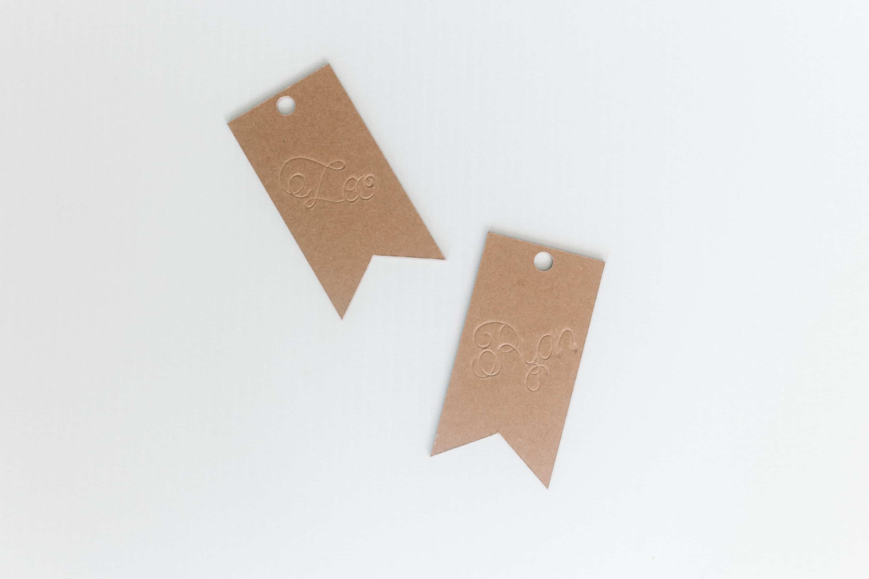 Your Cricut scoring wheel is the perfect engraving tool and I show you how with this engraved chipboard gift tags tutorial! From overthebigmoon.com!
